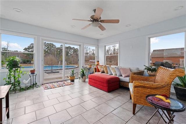 sunroom with ceiling fan