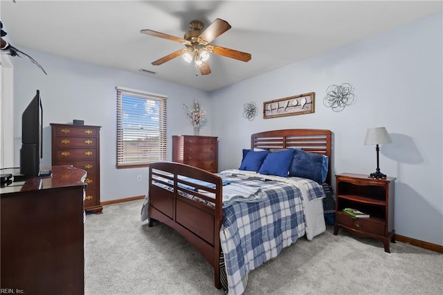 bedroom featuring ceiling fan and light colored carpet