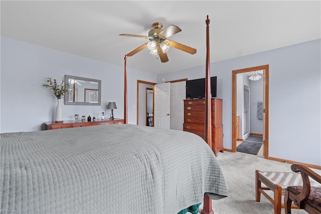 carpeted bedroom featuring ceiling fan and ensuite bathroom