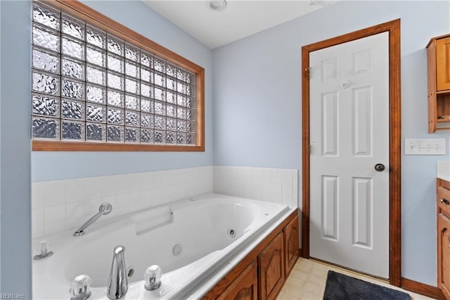 bathroom featuring vanity and a tub