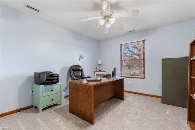 office space featuring ceiling fan and light carpet