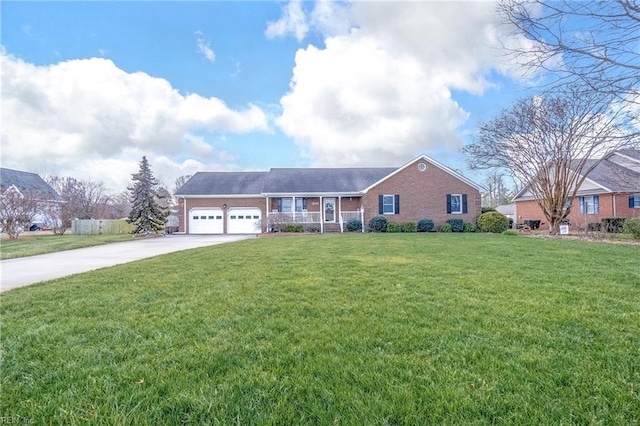 view of front of property featuring a garage and a front lawn