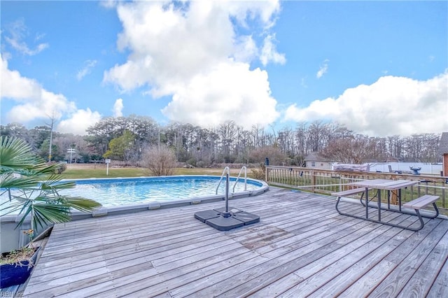 view of pool with a deck