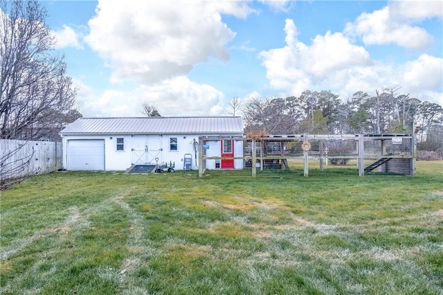 view of yard with an outbuilding and a garage