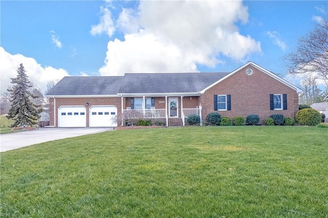 single story home with a porch, a garage, and a front yard