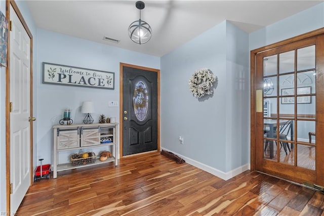 entrance foyer with dark hardwood / wood-style flooring