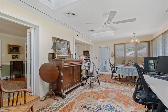 tiled office space with ceiling fan with notable chandelier, track lighting, and crown molding