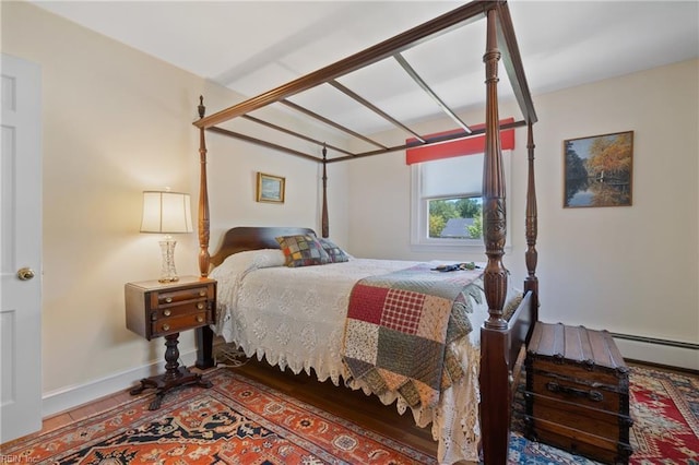 bedroom with a baseboard heating unit