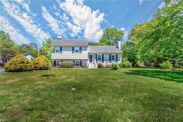 tri-level home featuring a front yard