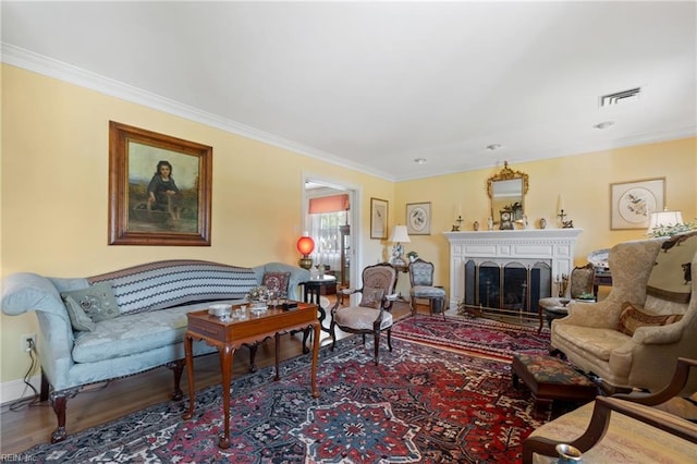 living room with hardwood / wood-style flooring and ornamental molding