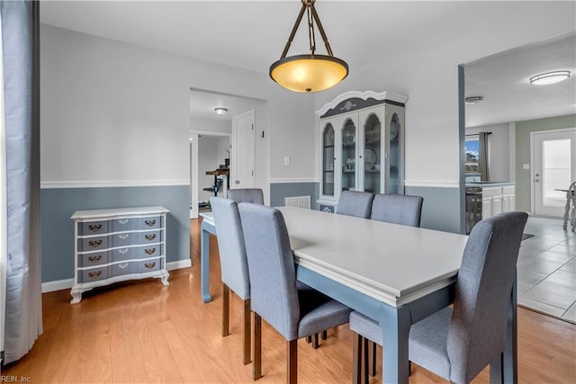 dining area with light hardwood / wood-style floors