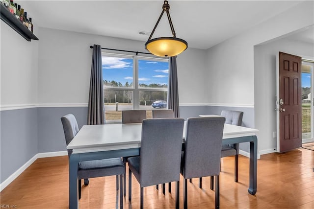 dining space featuring light hardwood / wood-style floors