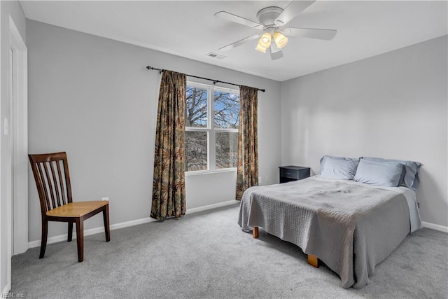 bedroom featuring ceiling fan and light colored carpet