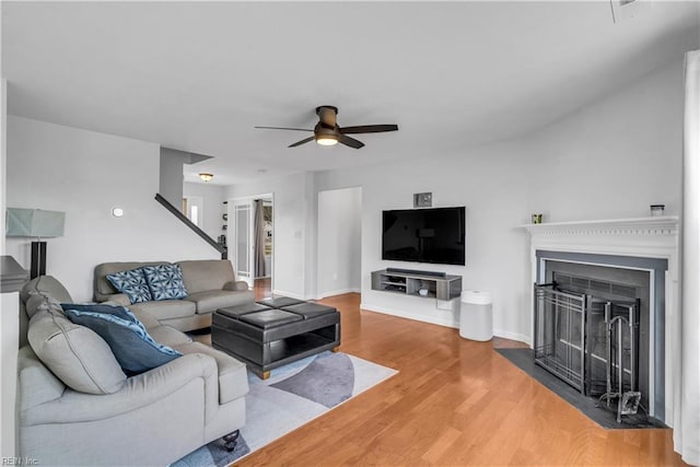 living room with hardwood / wood-style flooring and ceiling fan