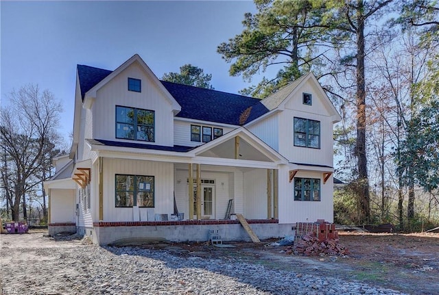 modern farmhouse featuring covered porch