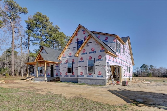 property under construction featuring covered porch