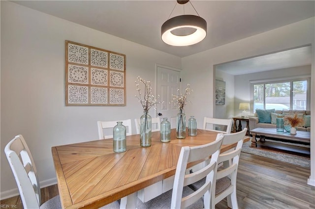 dining room with hardwood / wood-style floors