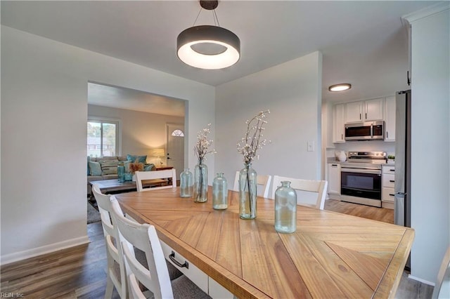 dining area featuring light wood-type flooring