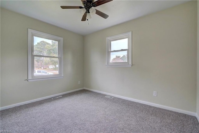 spare room with ceiling fan and carpet flooring