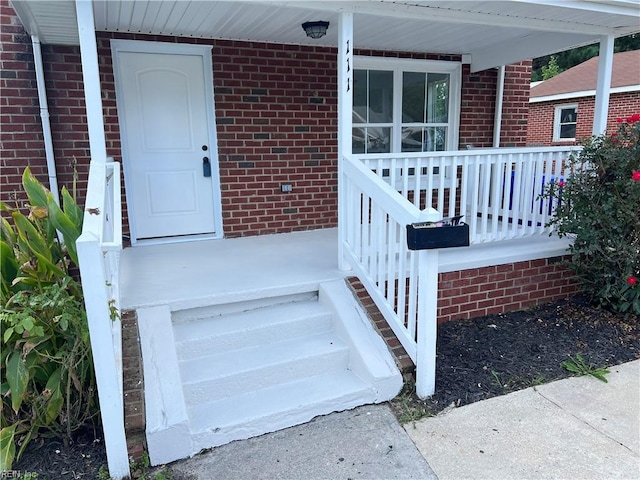 property entrance featuring a porch