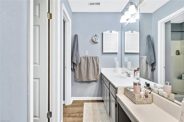 bathroom with vanity and hardwood / wood-style floors