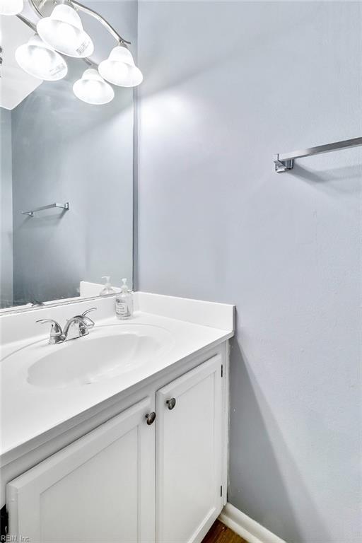 bathroom featuring vanity and a notable chandelier