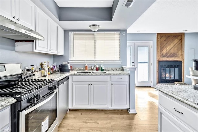 kitchen featuring white cabinetry, sink, and stainless steel appliances