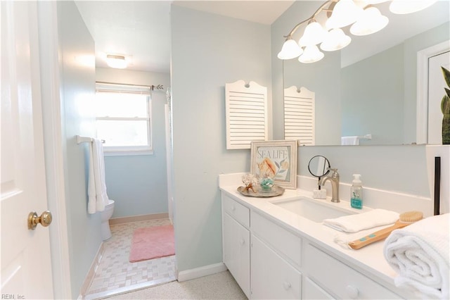 bathroom featuring toilet and vanity