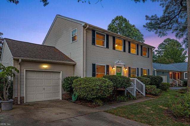 colonial home with a garage