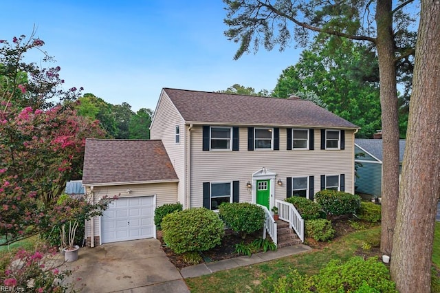 colonial home with a garage