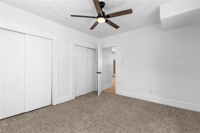 unfurnished bedroom with ceiling fan and carpet floors