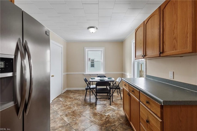 kitchen with stainless steel fridge with ice dispenser