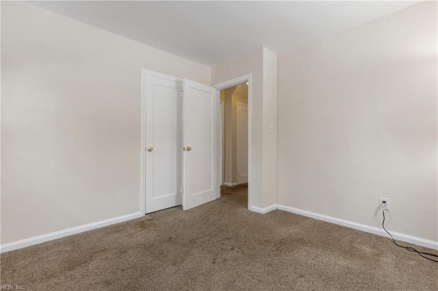 unfurnished room featuring carpet floors