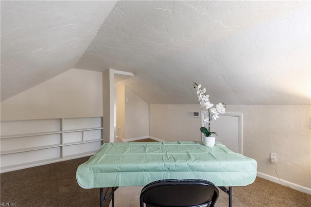 playroom with vaulted ceiling, carpet, a textured ceiling, and built in shelves