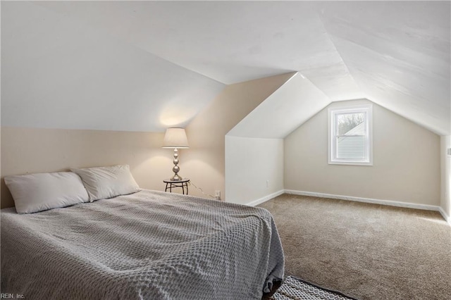 carpeted bedroom with vaulted ceiling