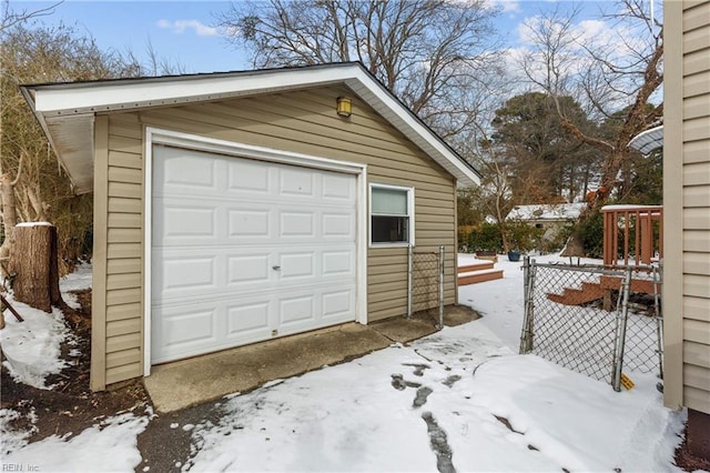 view of snow covered garage