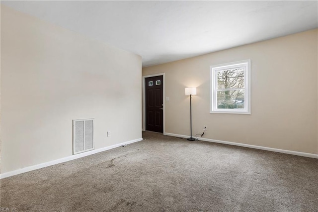 unfurnished room with carpet flooring