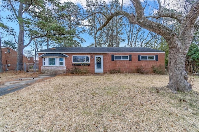 ranch-style home with a front yard