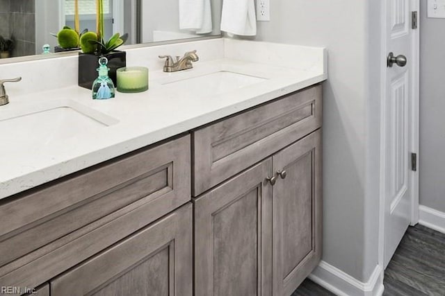 bathroom with hardwood / wood-style floors and vanity