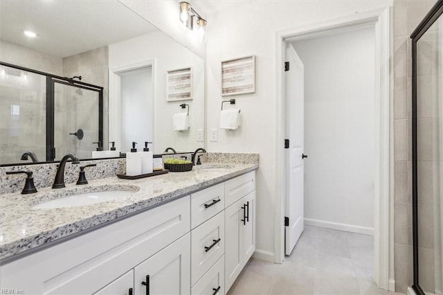 bathroom featuring tile patterned floors, walk in shower, and vanity