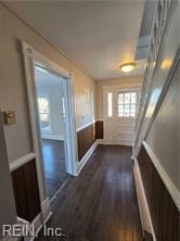 corridor featuring dark wood-type flooring