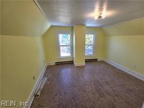 bonus room featuring baseboard heating and lofted ceiling