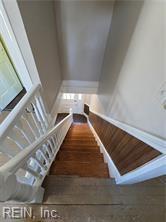 stairway featuring hardwood / wood-style floors