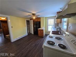 kitchen featuring electric stove, ceiling fan, dark hardwood / wood-style floors, fridge, and sink