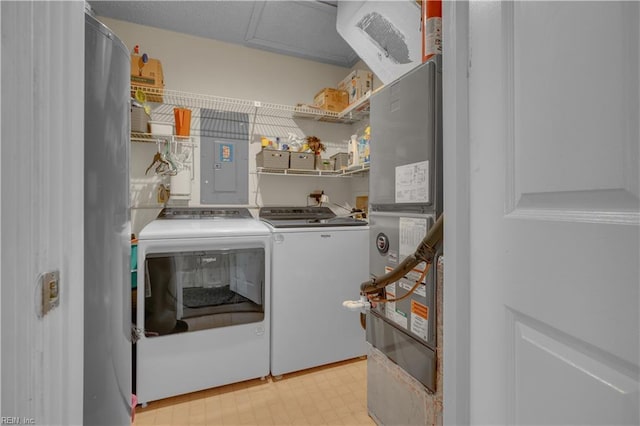 laundry room featuring electric panel and independent washer and dryer