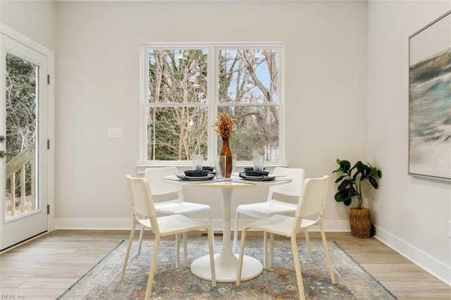 dining area featuring light wood-type flooring