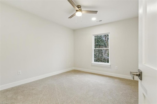 unfurnished room with ceiling fan and carpet flooring