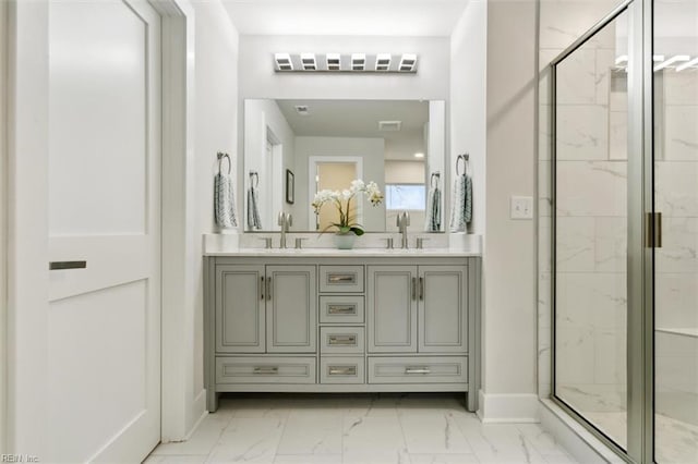 bathroom featuring vanity and an enclosed shower