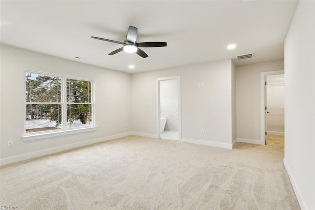 empty room with light carpet and ceiling fan