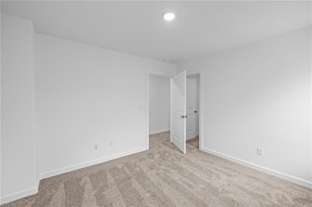 unfurnished bedroom featuring light colored carpet